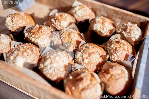 Image of close up of muffins in wooden box