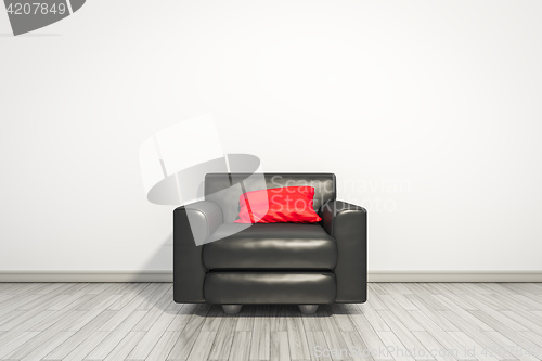 Image of armchair with red pillow