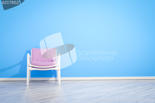 Image of armchair blue wall