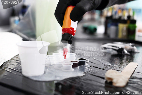 Image of Color ink tattoo. Worktop in the tattoo studio