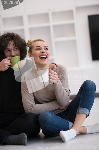 Image of young couple in their new home