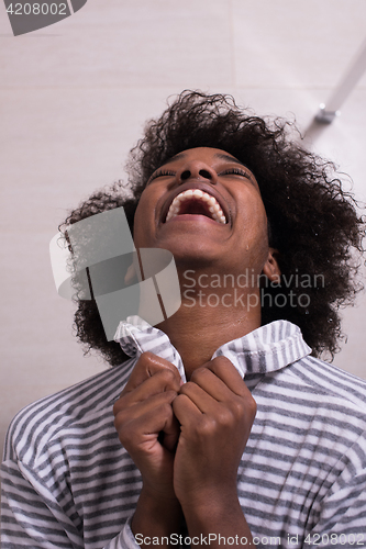 Image of beautiful black woman wearing  bathrobe