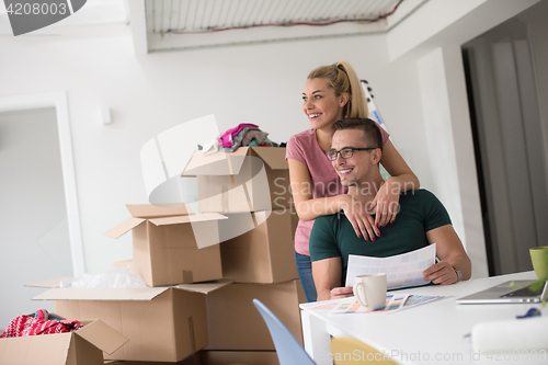 Image of Young couple moving in a new home