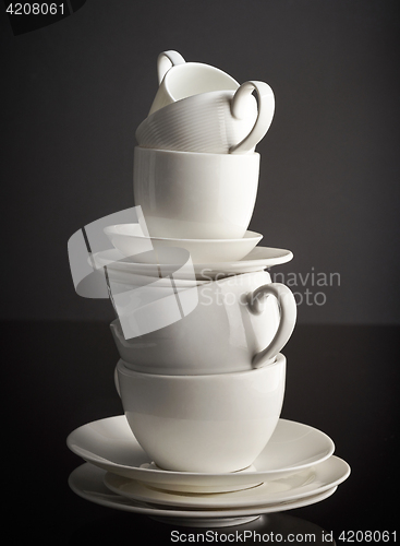 Image of stack of white coffee cups and plates