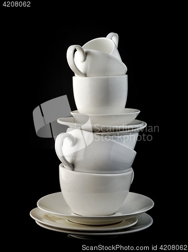 Image of stack of white coffee cups and plates