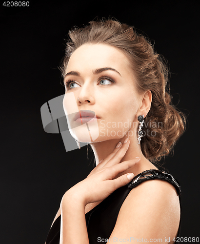 Image of woman with diamond earrings