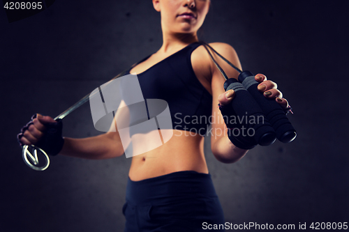 Image of close up of sporty woman with jumping rope