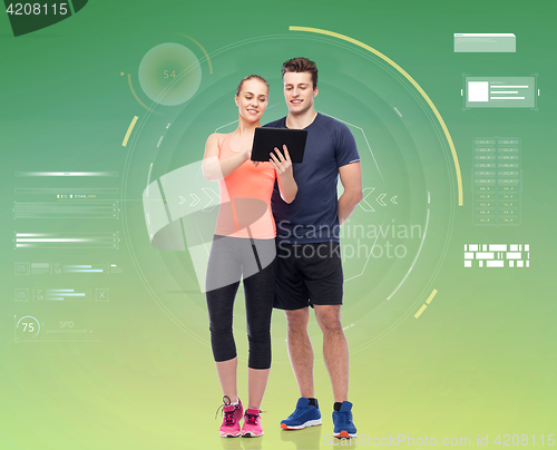 Image of happy sportive man and woman with tablet pc