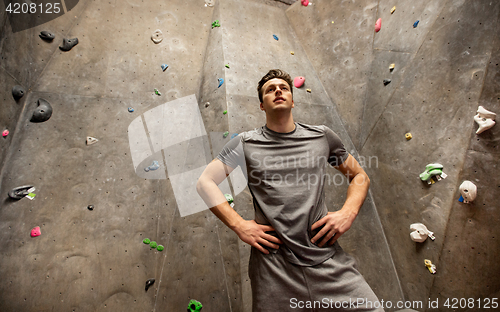 Image of young man exercising at indoor climbing gym