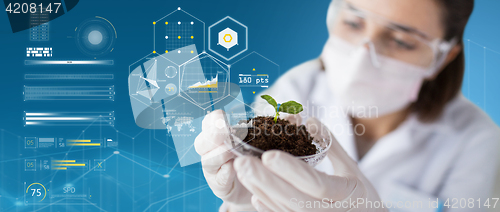 Image of scientist with plant and soil over virtual charts