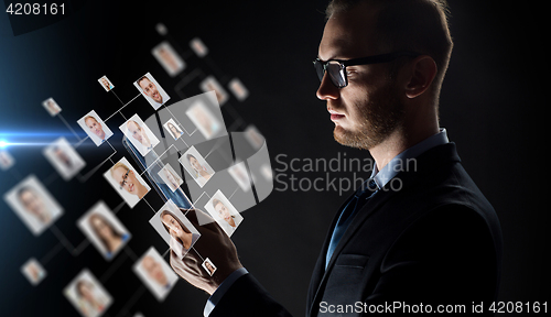 Image of close up of businessman with tablet pc and icons