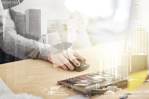 Image of pregnant businesswoman with computer at office