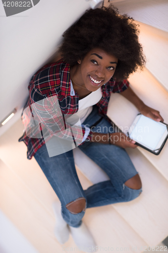 Image of black woman using her electronic tablet