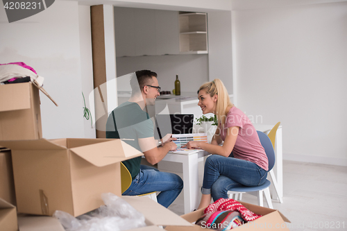 Image of Young couple moving in a new home