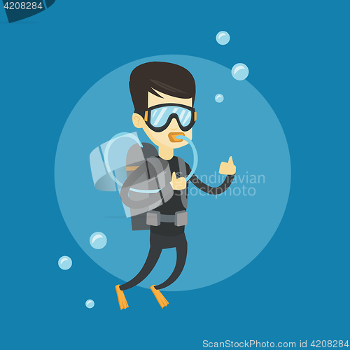 Image of Man diving with scuba and showing ok sign.