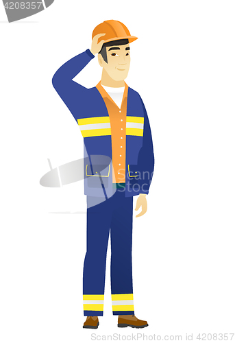 Image of Young asian builder in workwear and hard hat.