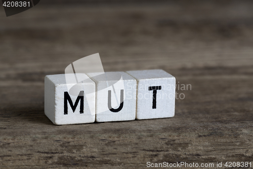 Image of German word courage, written in cubes