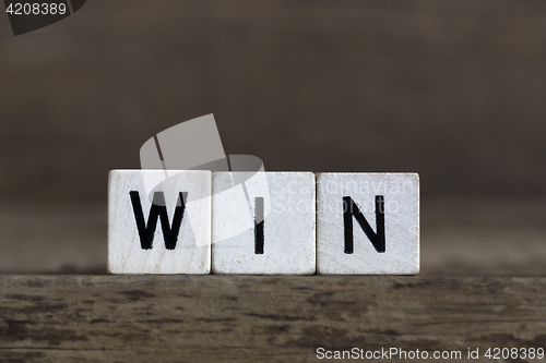 Image of Win, written in cubes