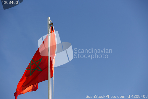 Image of National flag of Morocco on a flagpole