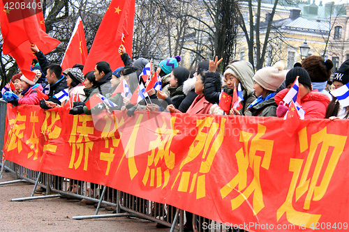 Image of Chinese Fans Wait to See Xi Jinping