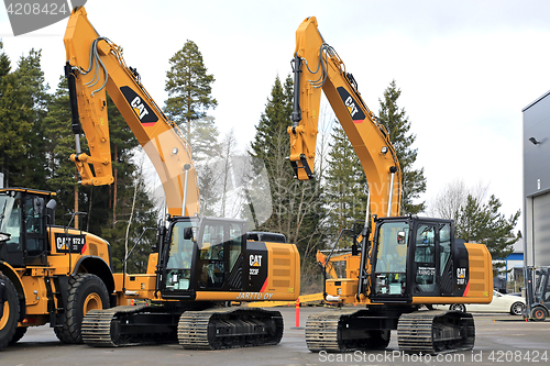 Image of Cat Hydraulic Excavators on a Yard