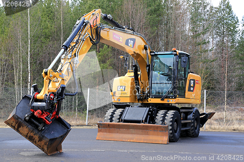 Image of Cat M318F Wheeled Excavator on Asphalt Yard