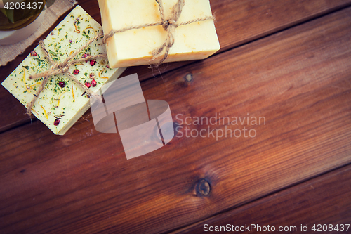 Image of close up of handmade soap bars on wood