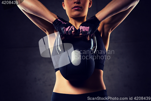 Image of close up of woman with kettlebell in gym