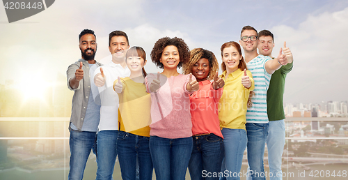 Image of international group of people showing thumbs up