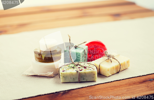 Image of close up of handmade soap bars on wood