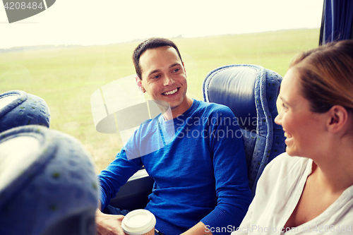 Image of group of happy passengers in travel bus