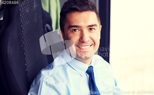 Image of close up of happy bus driver or businessman