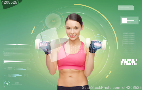 Image of happy sporty woman with dumbbells flexing biceps