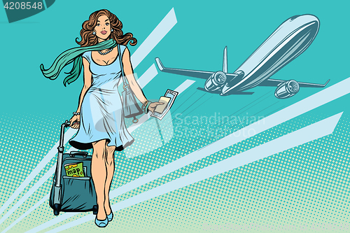 Image of Beautiful young woman with Luggage at the airport