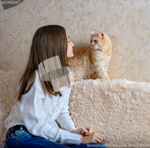 Image of Girl and red cat