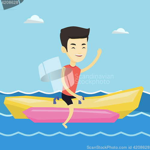 Image of Tourists riding a banana boat vector illustration.