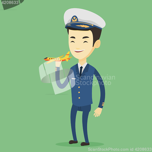 Image of Cheerful airplane pilot with model of airplane.