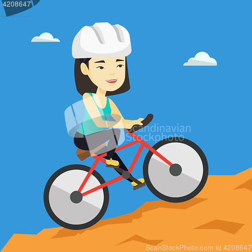 Image of Young woman on bicycle traveling in the mountains.