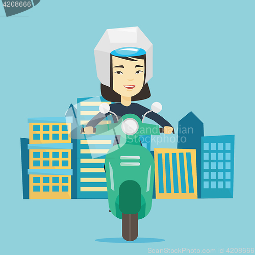 Image of Woman riding scooter in the city.