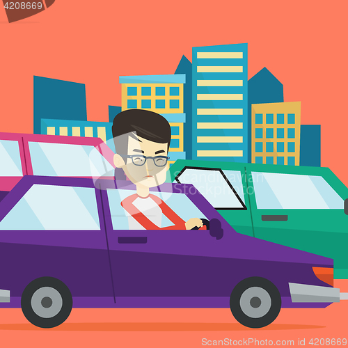 Image of Angry asian man in car stuck in traffic jam.