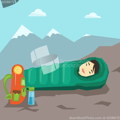 Image of Woman sleeping in sleeping bag in the mountains.