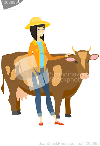 Image of Farmer standing with crossed arms near cow.