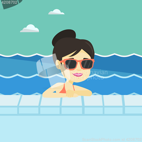 Image of Smiling young man in swimming pool.