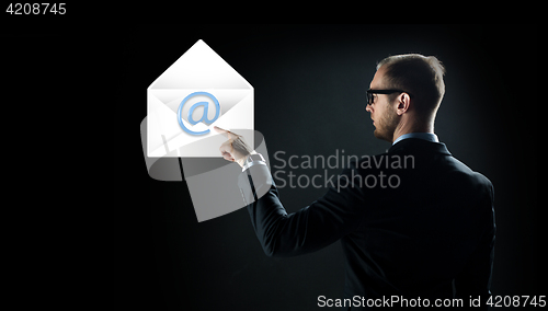 Image of businessman pointing finger to