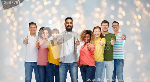 Image of international group of people showing thumbs up