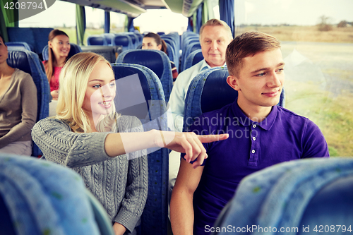 Image of group of tourists in travel bus