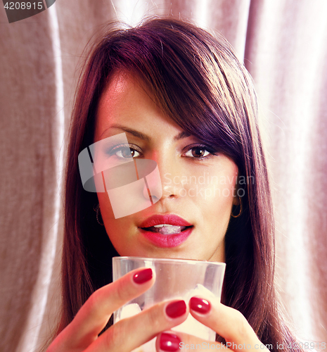 Image of face and glass of whisky