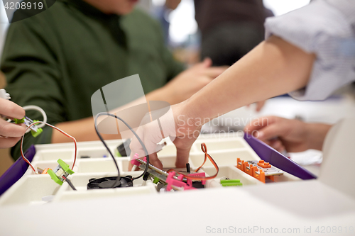 Image of children with building kit at robotics school