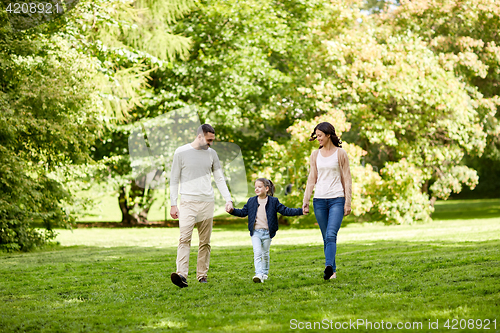 Image of happy family walking in summer park