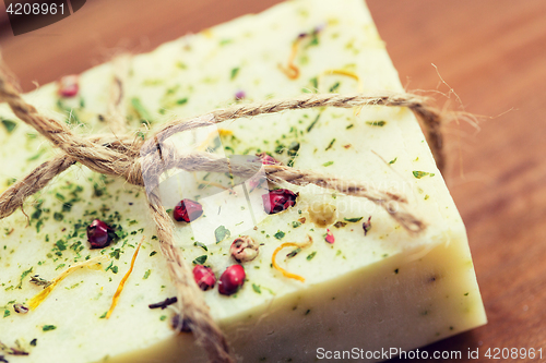 Image of close up of handmade soap bars on wood